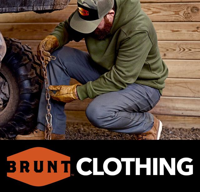 Brunt Clothing. Man wearing a Brunt hat, hoodie, pants and boots.