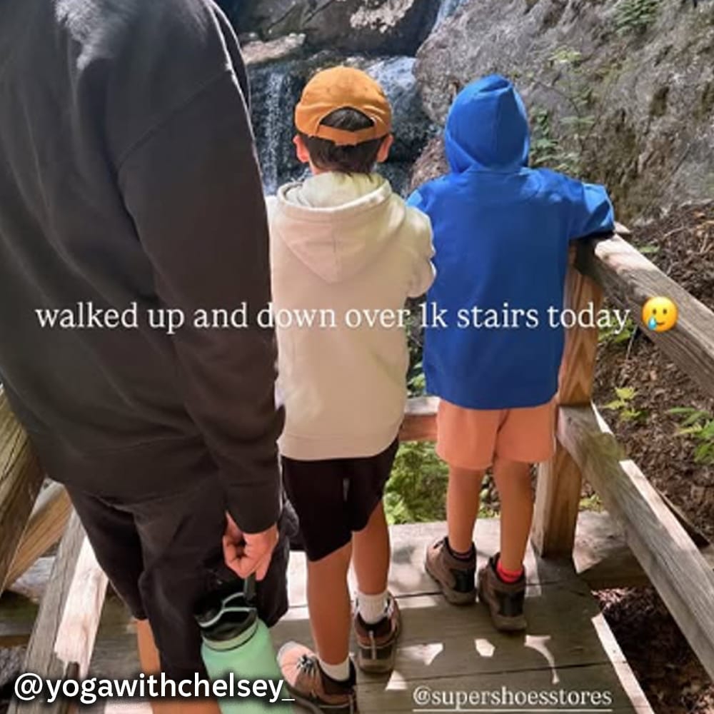 A father and his two children walking down stairs with text overlaid: "walked up and down over 1k stairs today 🥲 @yogawithchelsey_". Featured style: Boy's Keen Waterproof Targhee Iv Hiker in brown. Shop this style.