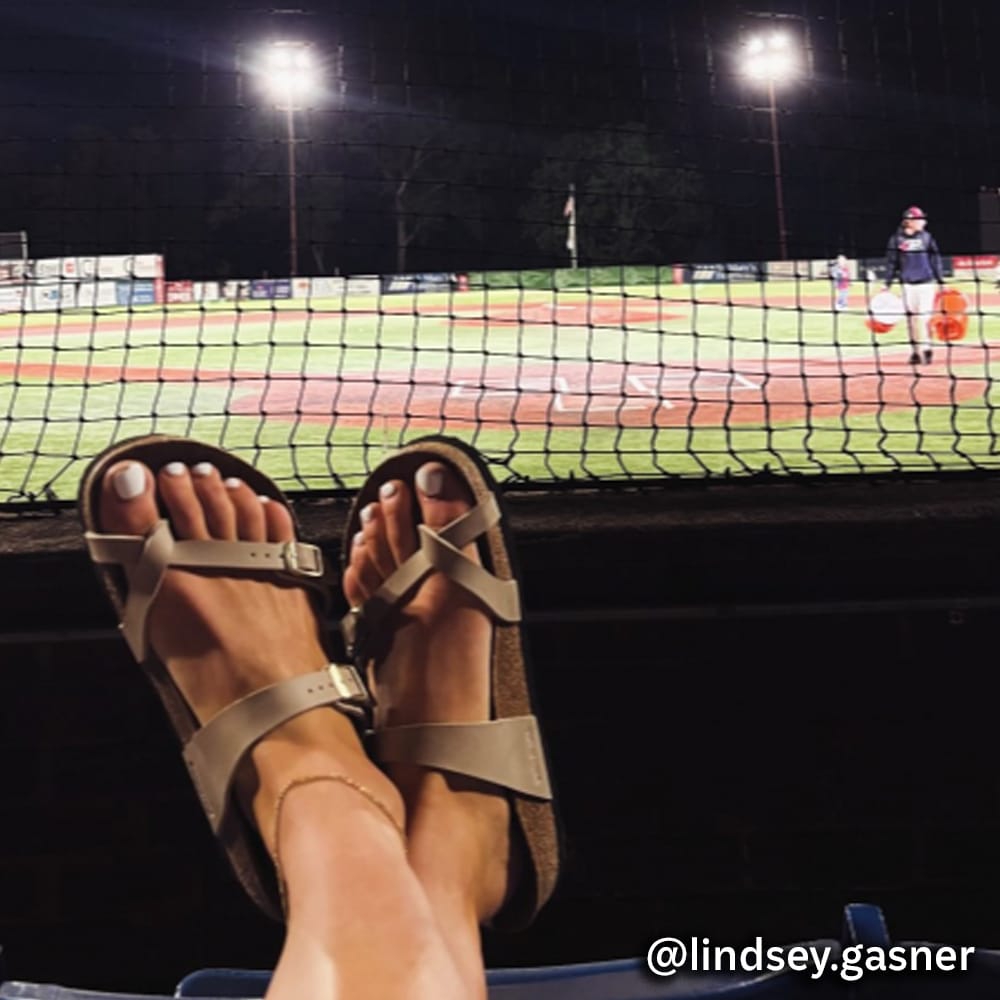Brown Sandals on foot @lindsey.gasner at a baseball game. Visit Super Shoes Instagram profile.