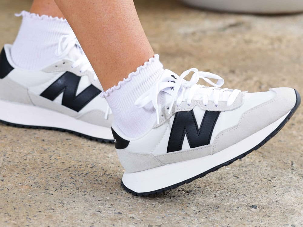 Women's New Balance 237 Classic Runner lace up sneaker in white.