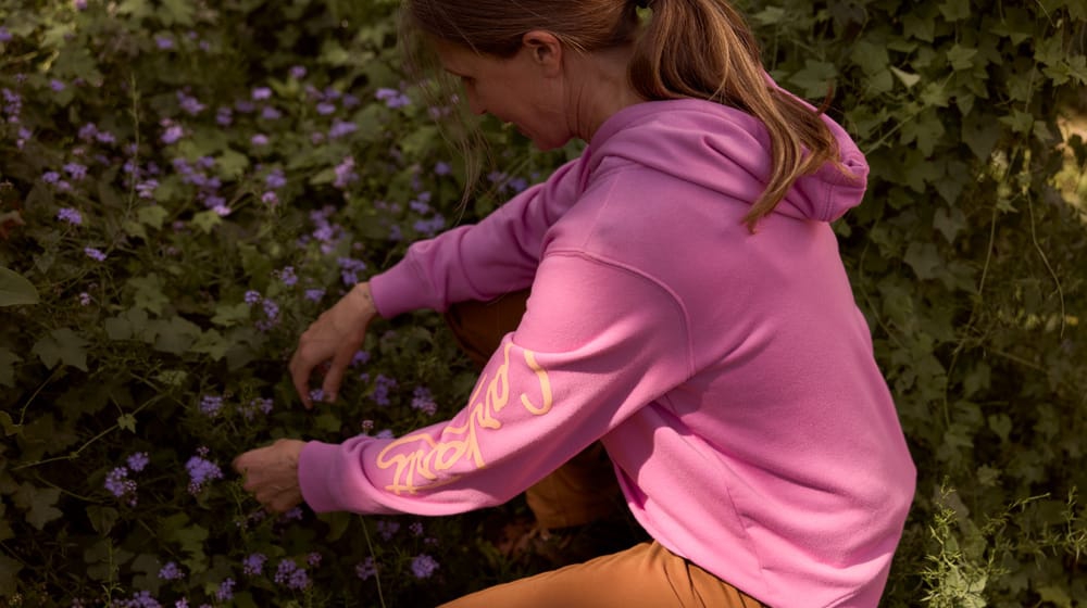 Women's Carhartt Sawyer Script Logo Hoodie in pink. 