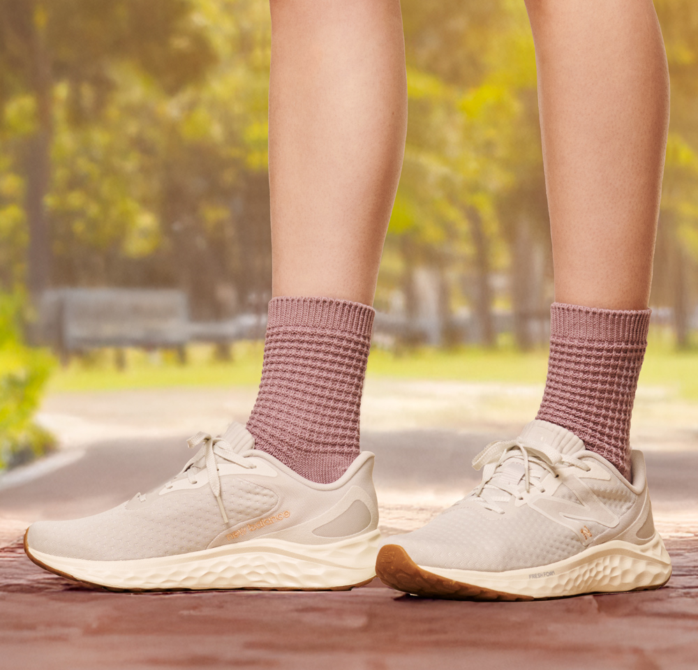 Featured Style: Women's New Balance Arishiv4 Runner in white.