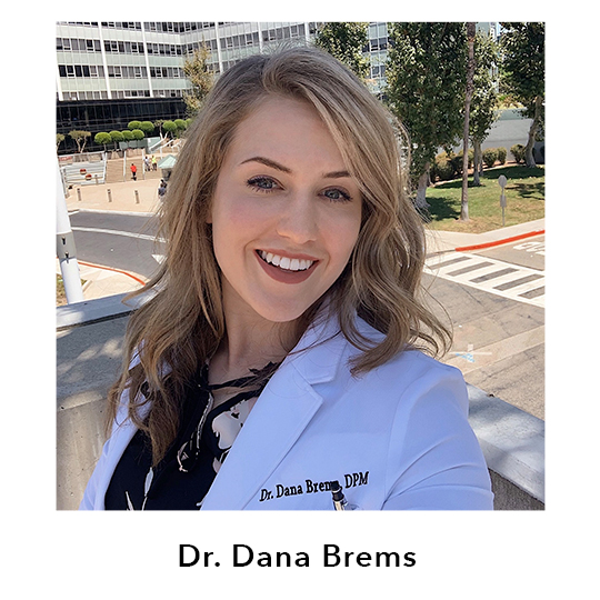 Dr. Dana Brems.  Dr. Dana shown wearing a white lab coat