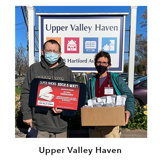 Upper Valley Haven. People holding boxes of donations shown.