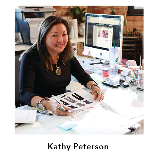Kathy Peterson.  Kathy Peterson shown working at a desk