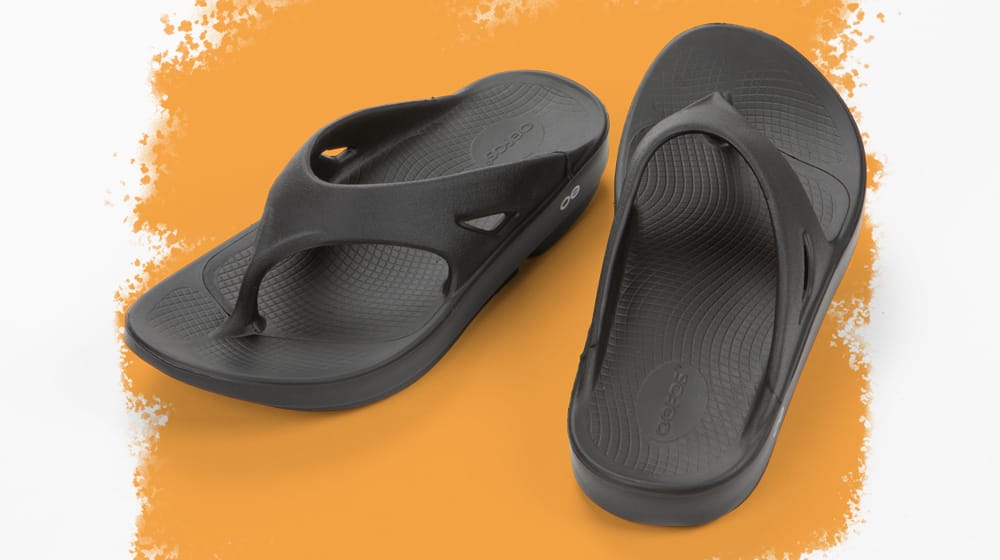 Featured style: Men's Oofos Ooriginal thong sandal in black.