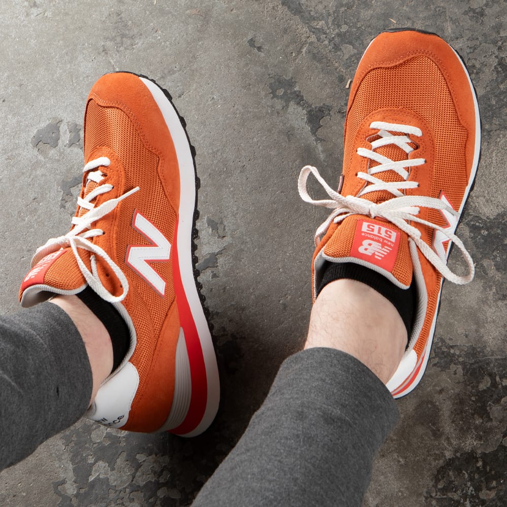 Featured style: Men's New Balance 515 Lifestyle Runner sneaker in orange.